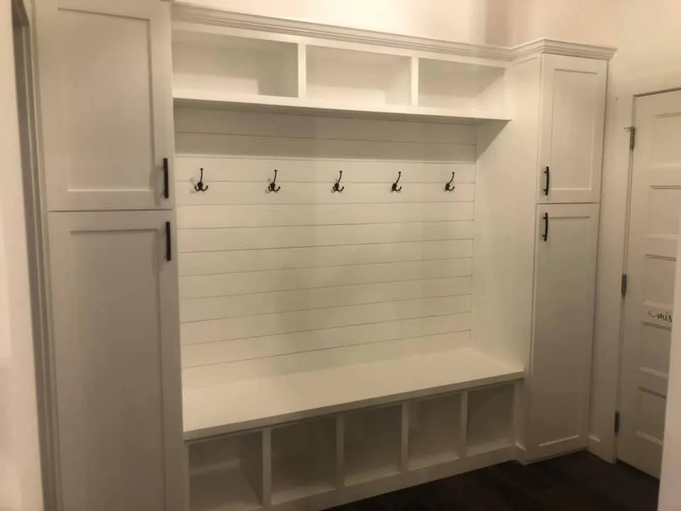 A mudroom bench with hooks and cubbies