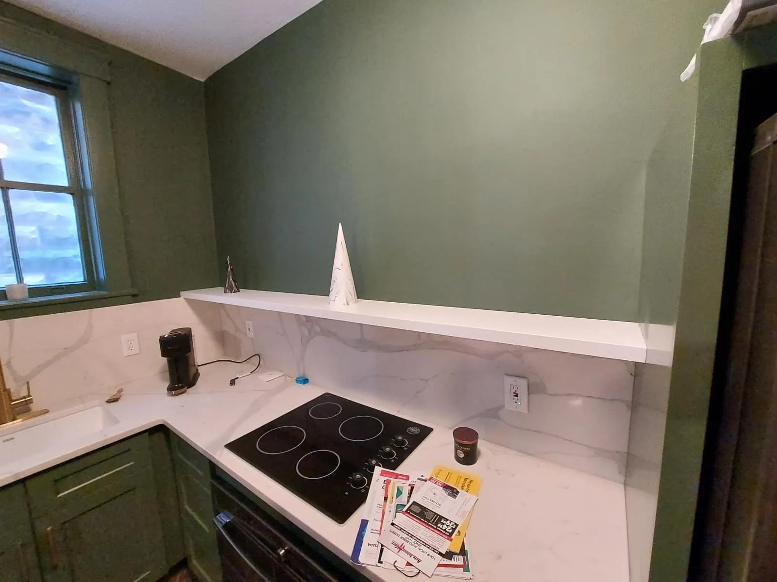 A kitchenette in the Lafayette Square condo, with our cabinetry