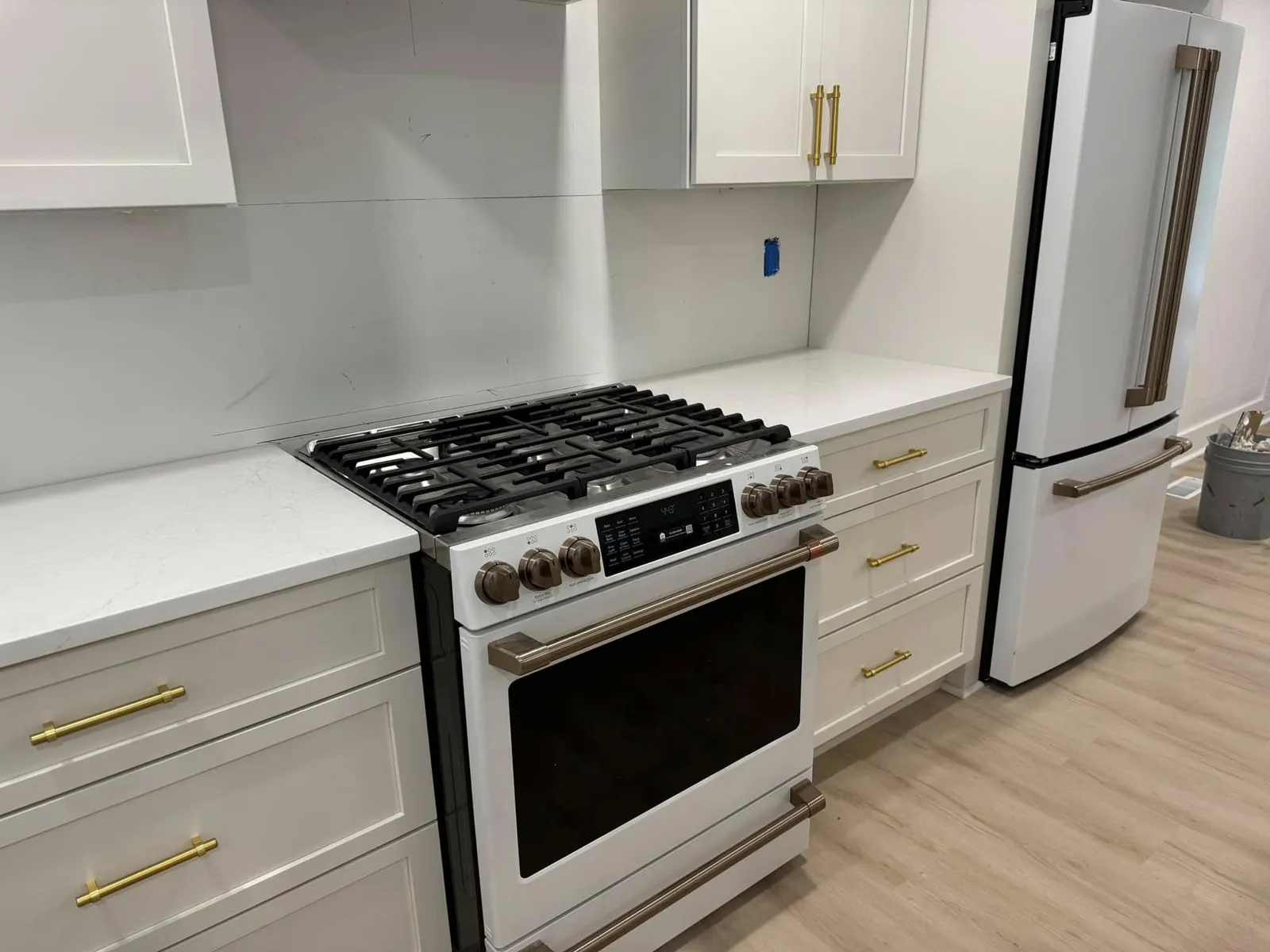 A white kitchen with gold hardware on Wilmington Island