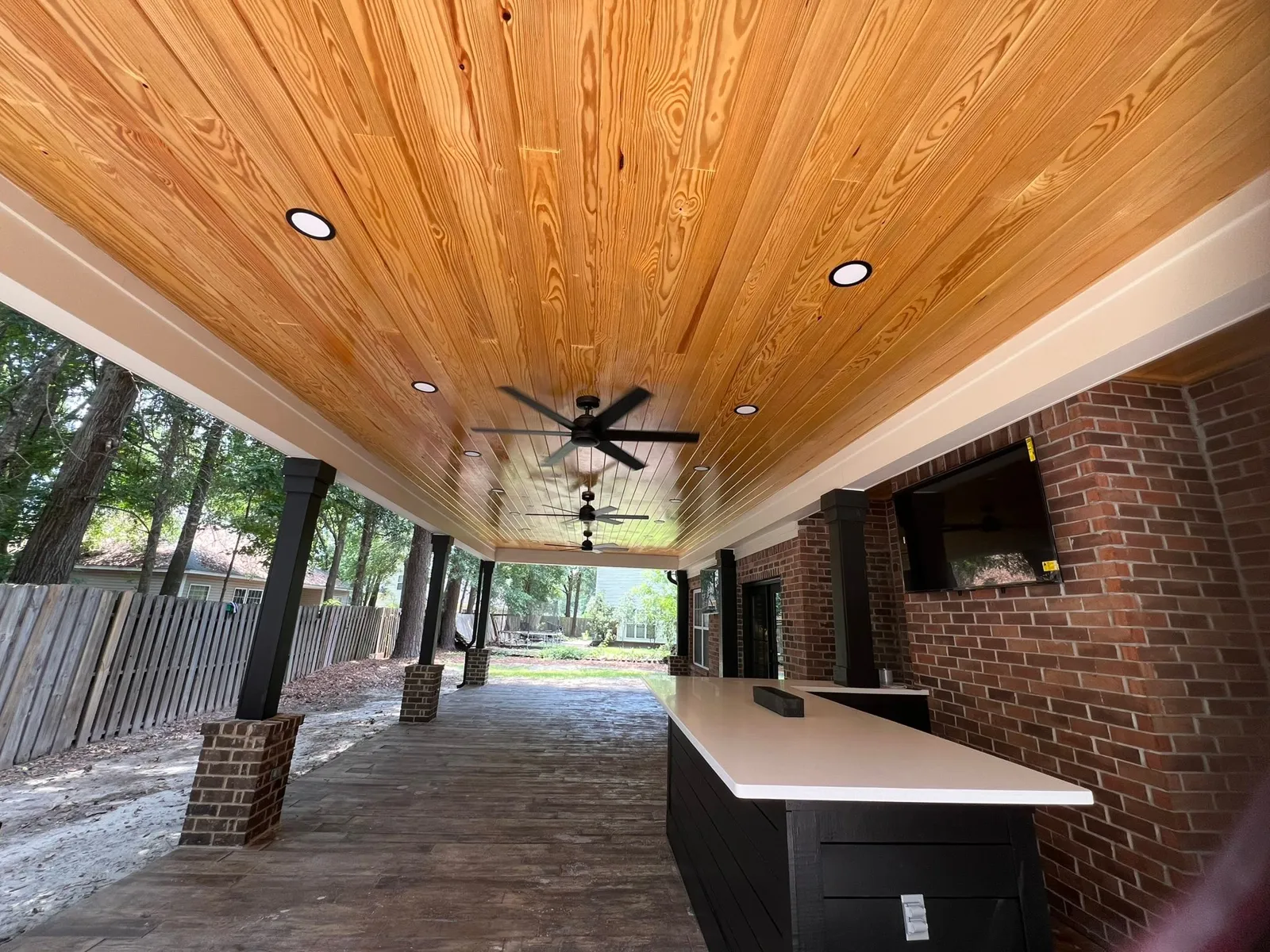 A pavilion with a pine ceiling and an outdoor bar in Rincon