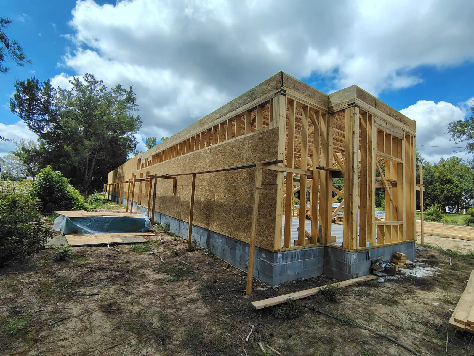 A new home framed and sheathed on a waterfront lot